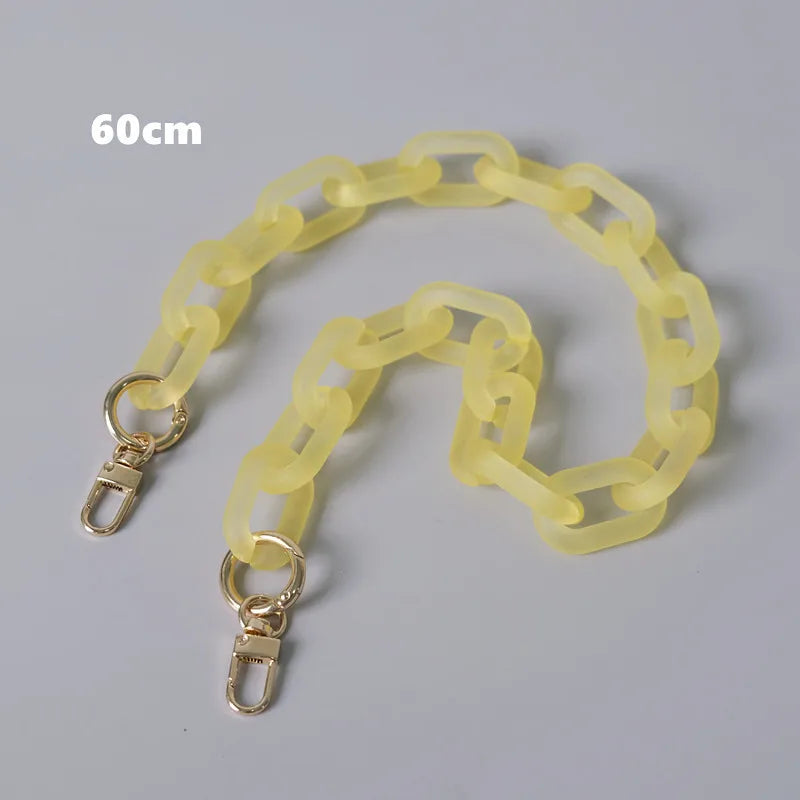 A light yellow adjustable detachable chain shoulder bag with a 60cm length displayed on a gray background.