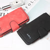A red and black card holder wallet set featuring a leather pouch and a metal pen on a white background.