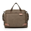 A brown canvas crossbody messenger bag with padded straps and flap.
