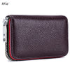 A dark purple genuine leather accordion card holder wallet with silver zipper details.