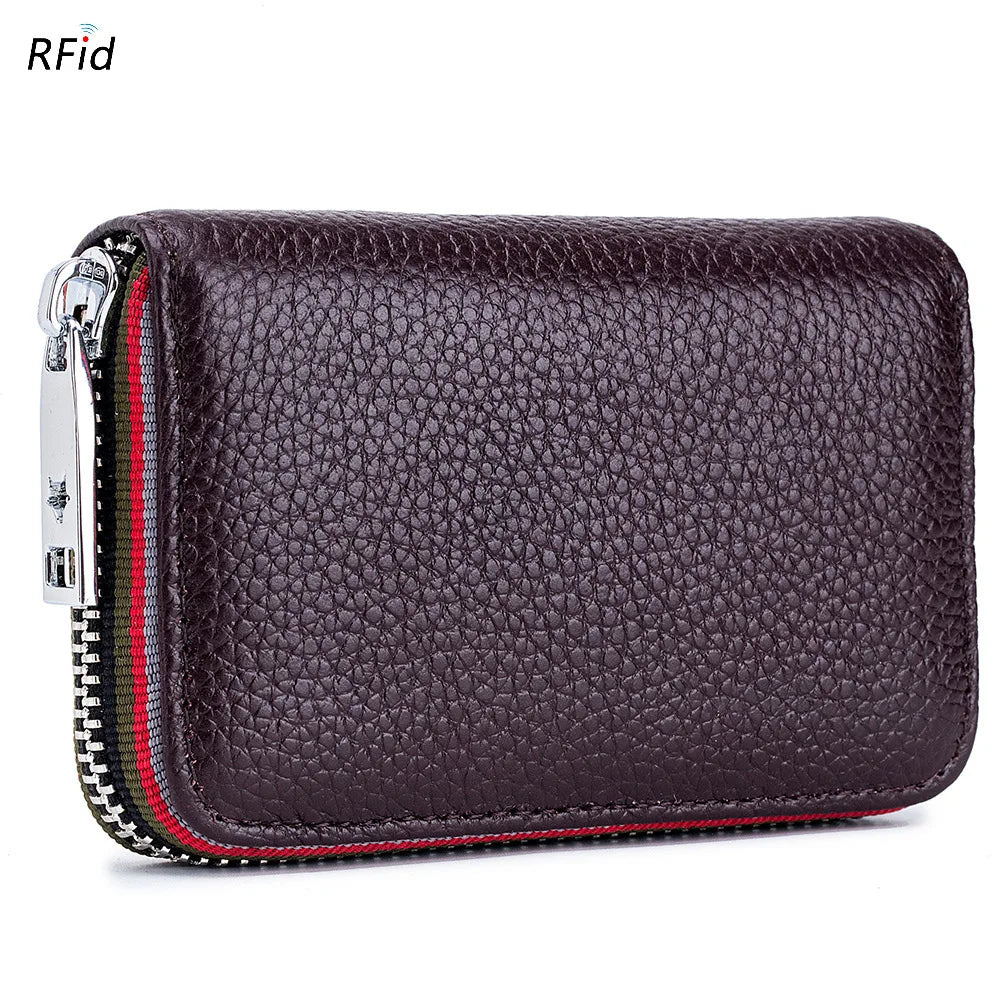 A dark purple genuine leather accordion card holder wallet with silver zipper details.