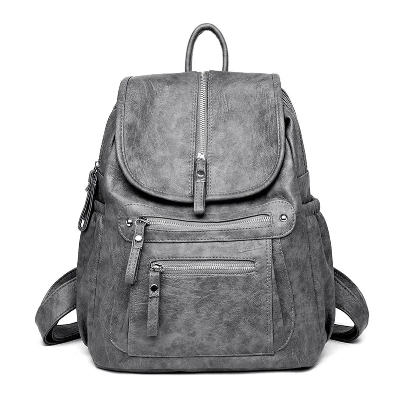A gray vintage soft leather backpack for women shown from the front.