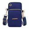 A navy blue waterproof nylon crossbody bag with gold hardware and a matching strap.
