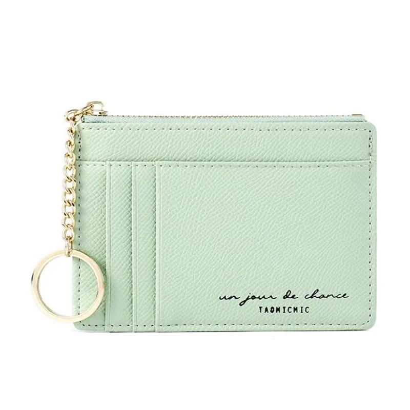 A light mint green compact PU leather zip wallet with a gold chain keychain.