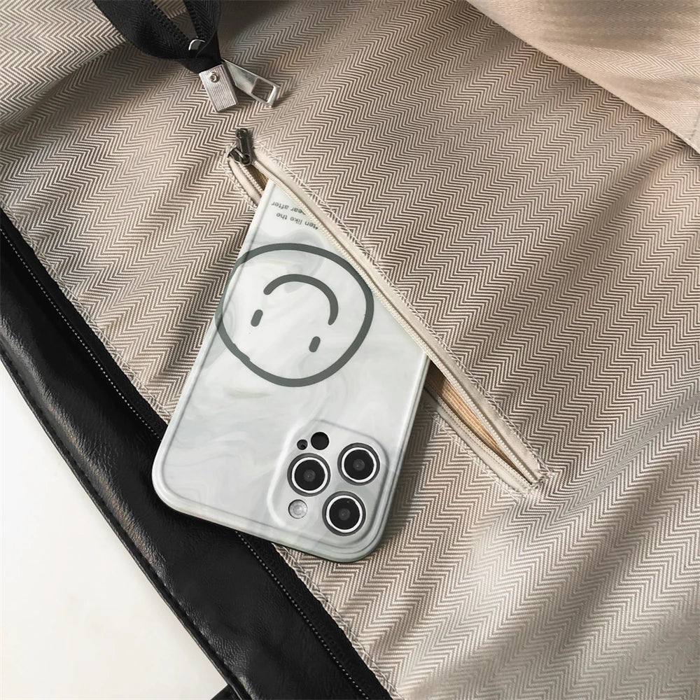 A white phone case with a smiley face is shown inside an oversized beige PU leather tote bag.