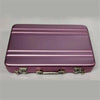 A rectangular purple aluminum case designed to hold credit cards and identification.