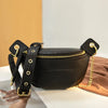 A black PU leather crossbody sling bag with gold hardware resting on a light surface.
