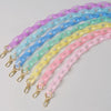 A collection of colorful, adjustable detachable chain shoulder bags in a rainbow gradient.