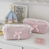 Pink rose sweetheart cosmetic storage pouch with a white lace trim and a wooden flower charm.