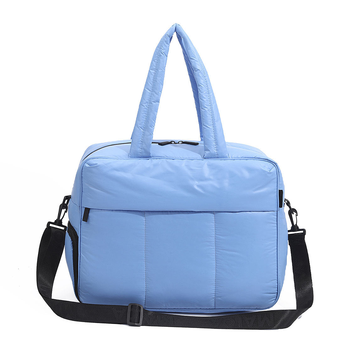 Light blue large capacity women's travel duffle bag with black straps