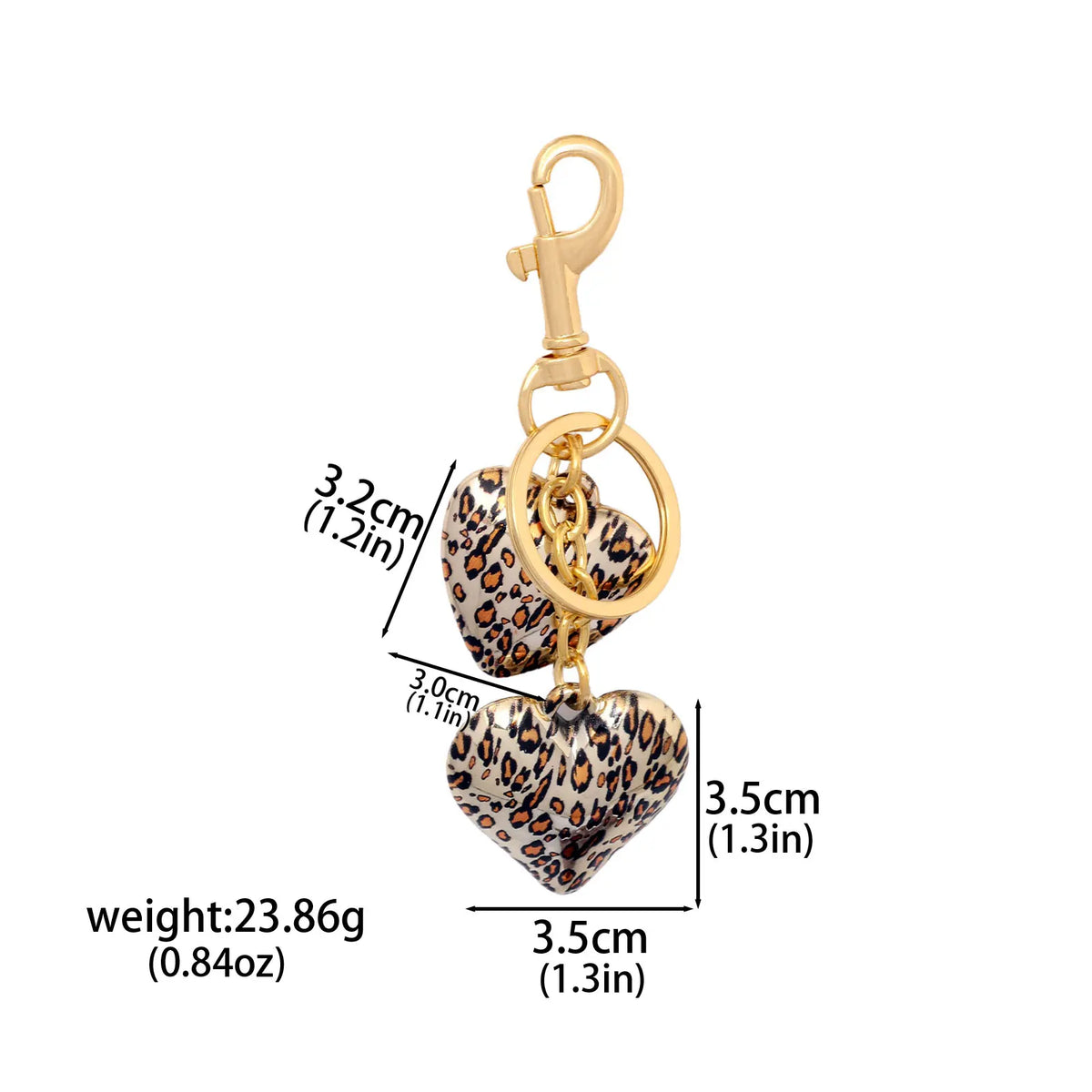 Gold-toned leopard print bow and heart charm keychain.