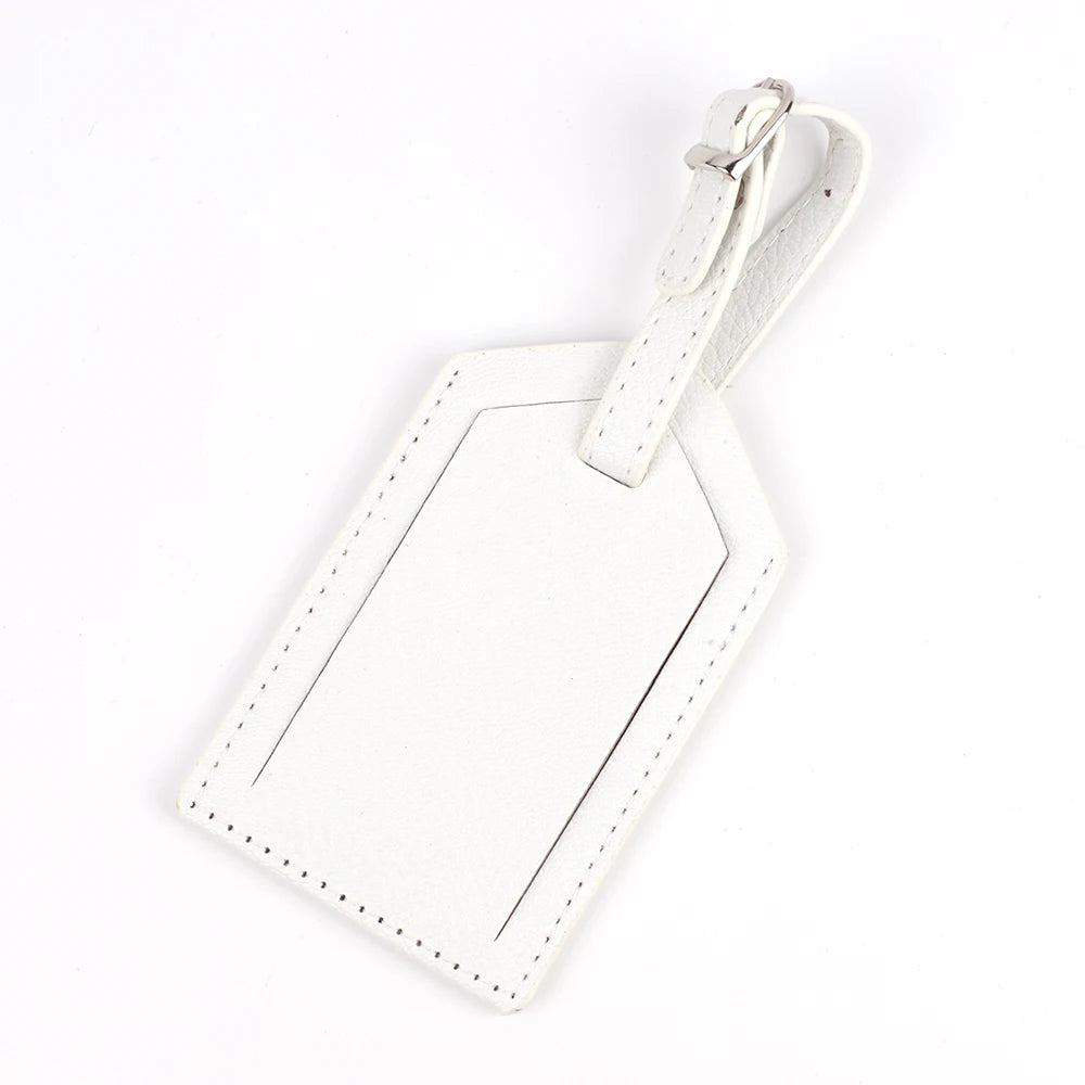 A white PU leather luggage tag with a rectangular shape and a leather strap attached.