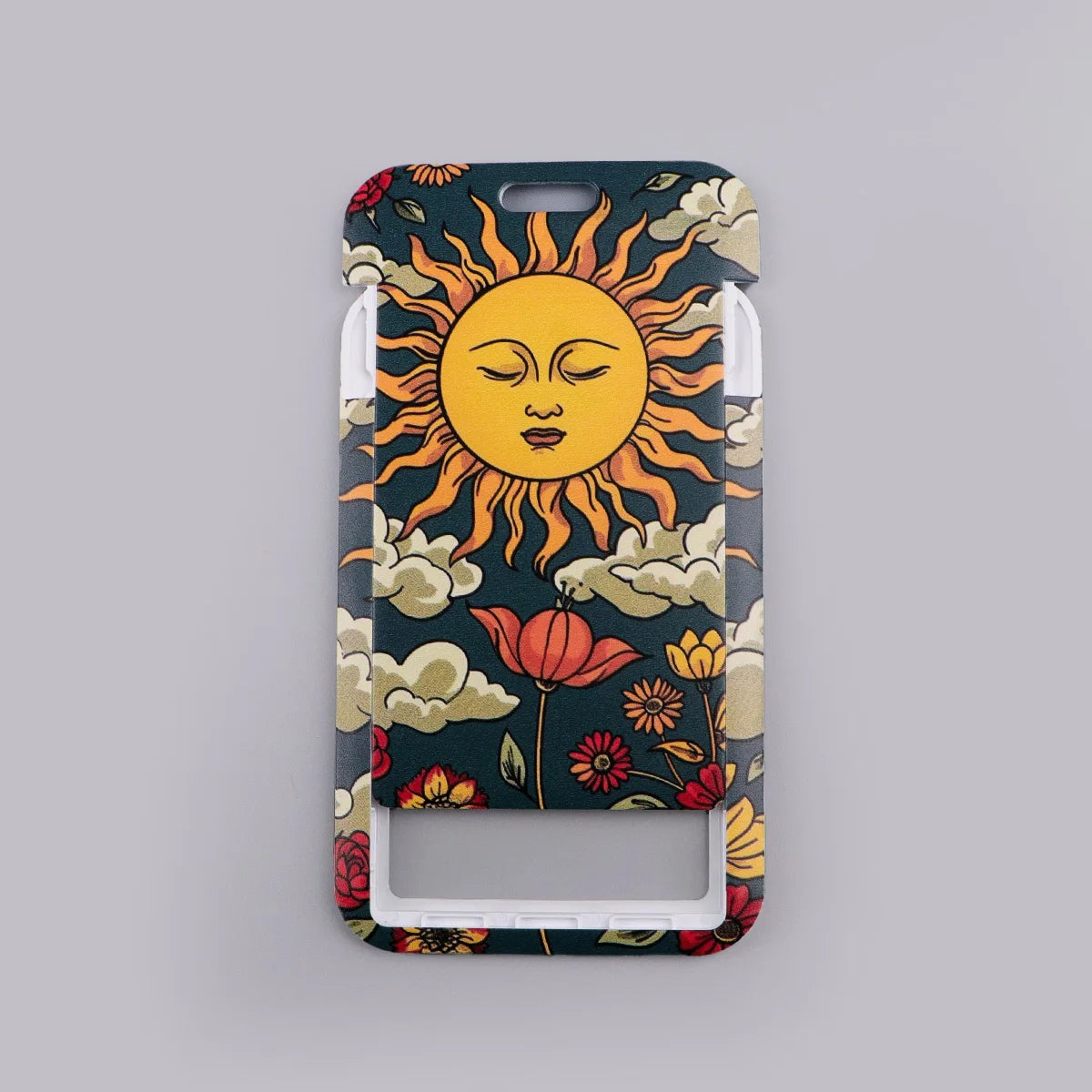A lanyard key ring featuring a stylized sun design with orange rays and clouds on a dark background.