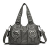 Dunkelgrabe Vintage Soft PU Leder-Schultertasche mit abgenutzter Textur und silberner Hardware.