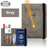 A grey elegant PU leather passport holder wallet with a black strap and a passport visible.