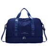 Navy blue expandable nylon travel duffle bag with dark blue straps and zipper pocket
