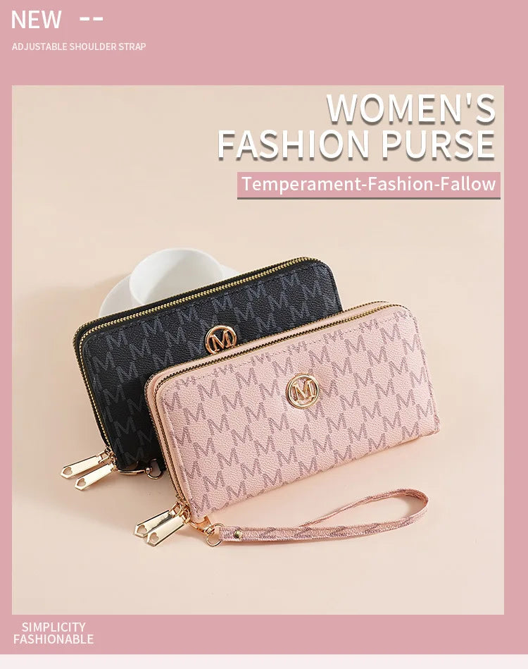 A women's fashion purse in pink and black featuring an adjustable shoulder strap and a double zipper design.