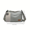 A light gray nylon crossbody shoulder bag with a rectangular phone slot and a strap shown from the side.