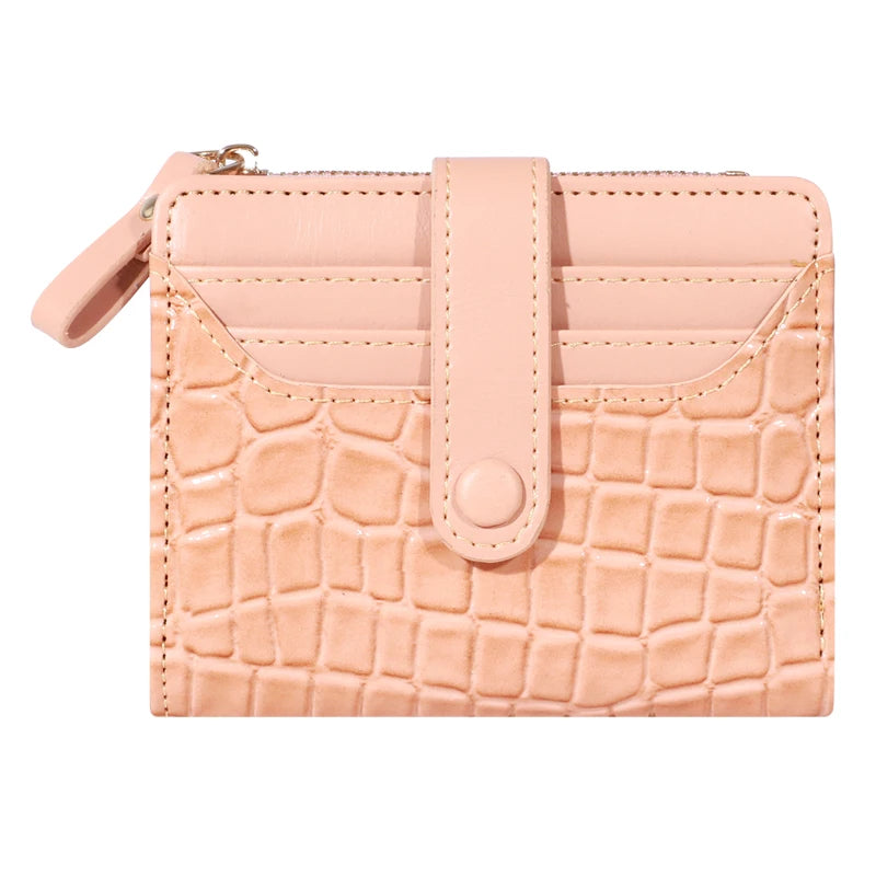 A light pink PU leather card wallet with a crocodile texture and a flap closure.
