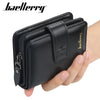 A black leather card holder wallet is shown being held by a hand.