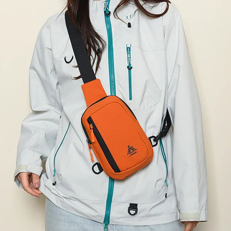 A white jacket features an orange nylon sling crossbody bag attached to the side.
