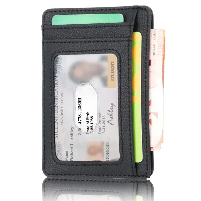 A black slim PU leather card holder wallet with a green card and a yellow pen inside.