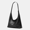 A black women's soft PU leather retro tote bag with a zipper closure.