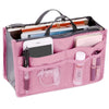 A pink multi-pocket organizer tote bag is shown open, displaying various cosmetic and essential items.