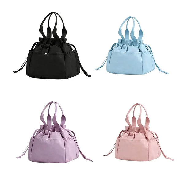 Three insulated drawstring lunch bags in black, light blue, and pink.