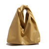 A smooth, tan leather minimalist crossbody tote bag folded and displayed against a white background.