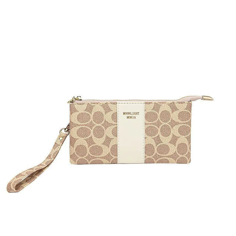 A beige and tan printed faux leather mini crossbody bag with a vertical stripe design.