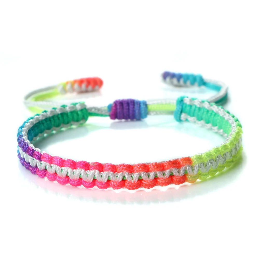 Handmade braided rope bracelet with colorful beads and green, purple, and pink accents.
