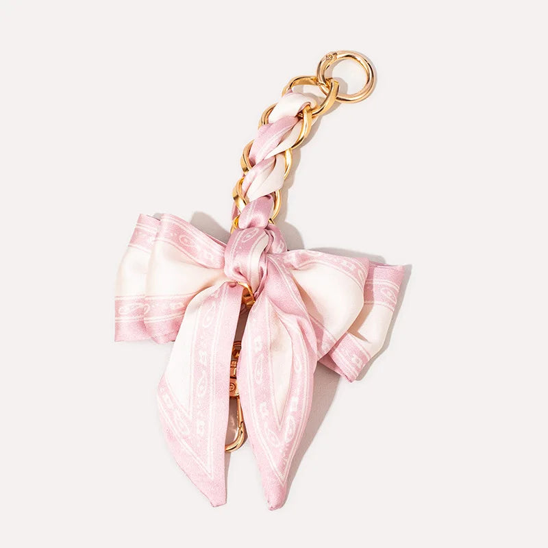 Pink satin adjustable bag strap with gold-tone hardware