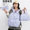 A woman is holding a purple star-patterned nylon backpack set, including a backpack and a pouch, against a light gray backgro