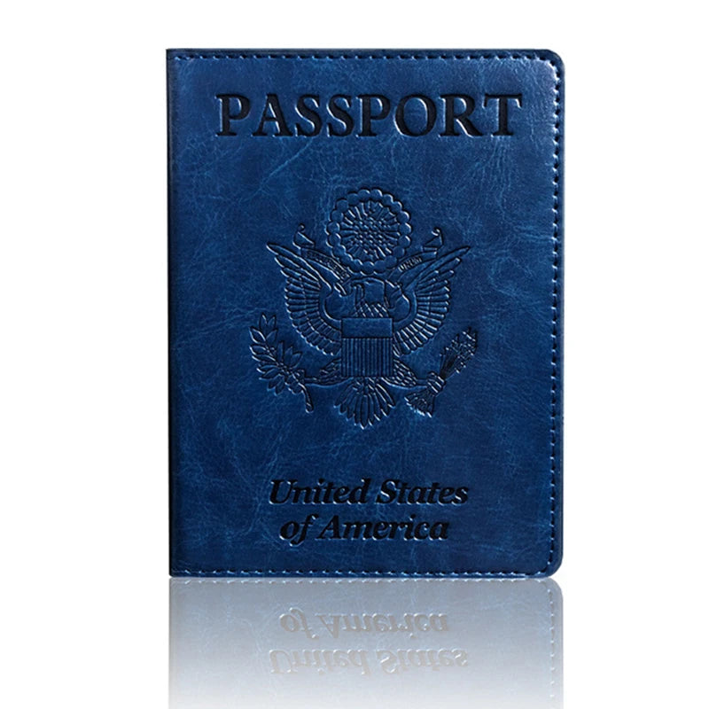 A dark blue leather passport holder wallet embossed with the United States of America eagle seal.