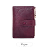 A deep purple leather foldable wallet with a flap and double zipper.