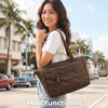 A woman holds a brown quilted multifunctional sound tote bag in a casual outdoor setting.