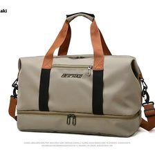 A beige and black durable travel gym bag with brown straps.