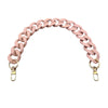 A pink acrylic chunky chain shoulder strap for a handbag.