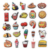 A collection of decorative shoe charms and pins featuring various food items like donuts, ice cream, and fruit.