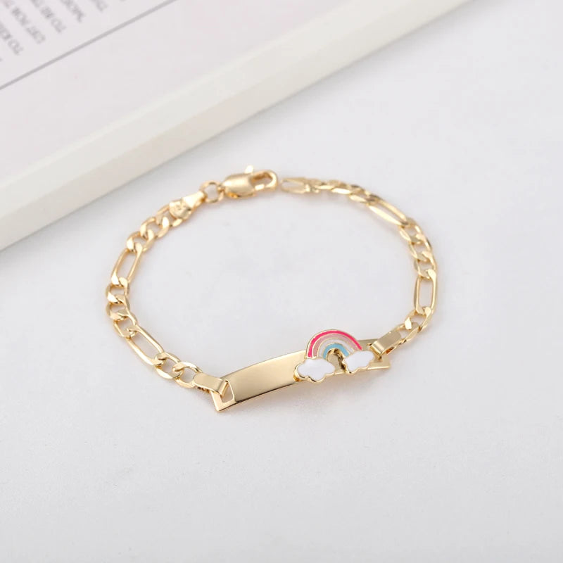 Gold chain bracelet with a rainbow heart charm on a white background.