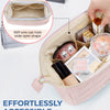 A pink padded makeup bag is shown open, displaying various cosmetic products and a stiff wire wide-open shape feature.