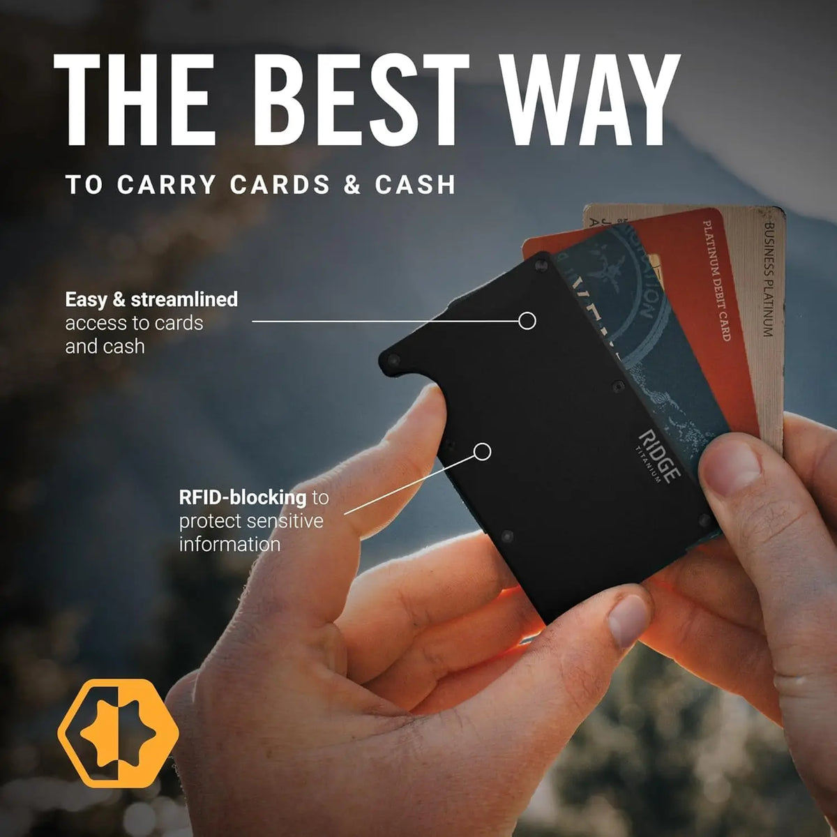 A hand holds a black slim RFID blocking wallet displaying cards and cash.