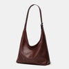 A dark brown women's soft PU leather retro tote bag with a zipper closure.