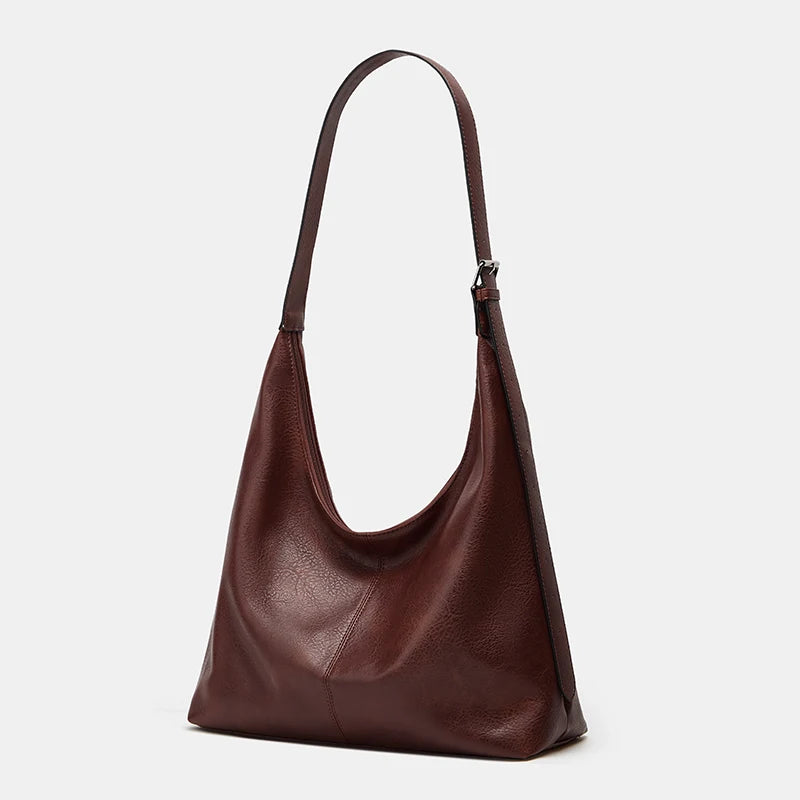 A dark brown women's soft PU leather retro tote bag with a zipper closure.