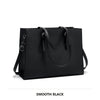 A smooth black large capacity laptop tote bag with a crocodile texture shown flat.