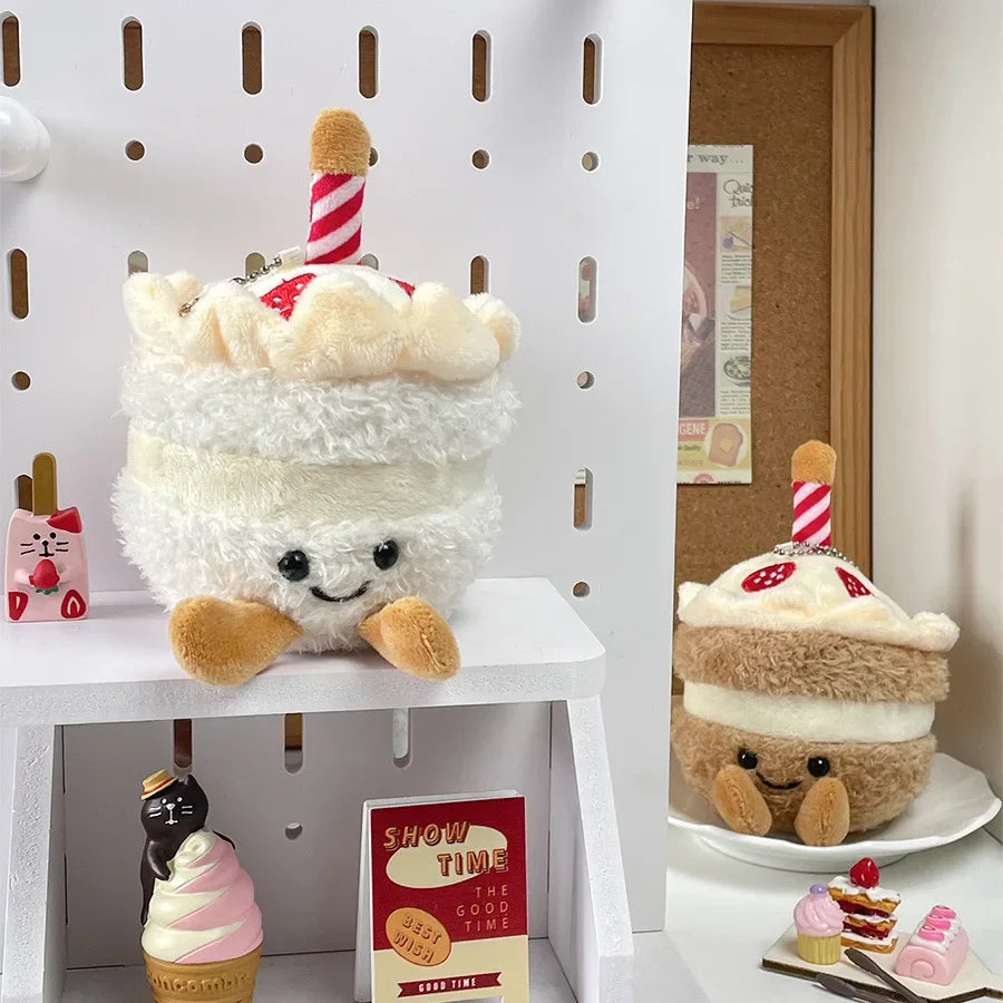 A white fluffy bread plush keychain with a smiling face and a striped straw hat.