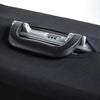 A close-up of a gray luggage protector cover mechanism on a black fabric suitcase.