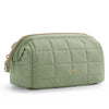 A soft sage green padded makeup bag with a wide-open design and gold zipper detail.