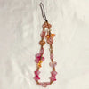 A delicate beaded phone charm strap with anti-lost lanyard featuring pink and amber gemstone beads.